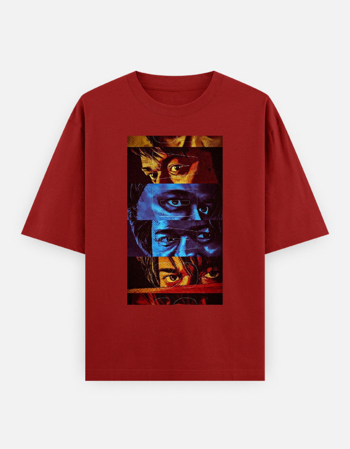A red oversized premium cotton t-shirt featuring a bold multi-color eye collage graphic print on the front. Modern unisex streetwear by LowKey.