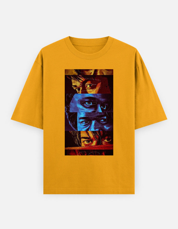 A yellow oversized premium cotton t-shirt featuring a bold multi-color eye collage graphic print on the front. Modern unisex streetwear by LowKey.