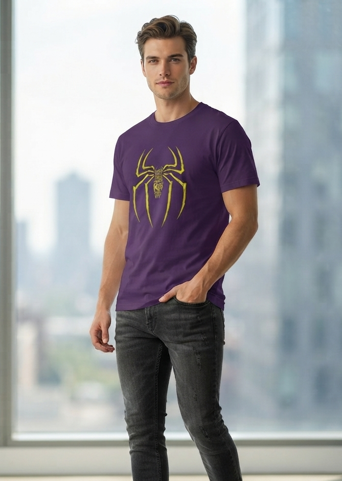 A man wearing a purple crewneck t-shirt with a yellow spider graphic on the chest, paired with dark gray jeans and white sneakers, standing in front of a large window with a blurred city skyline background.