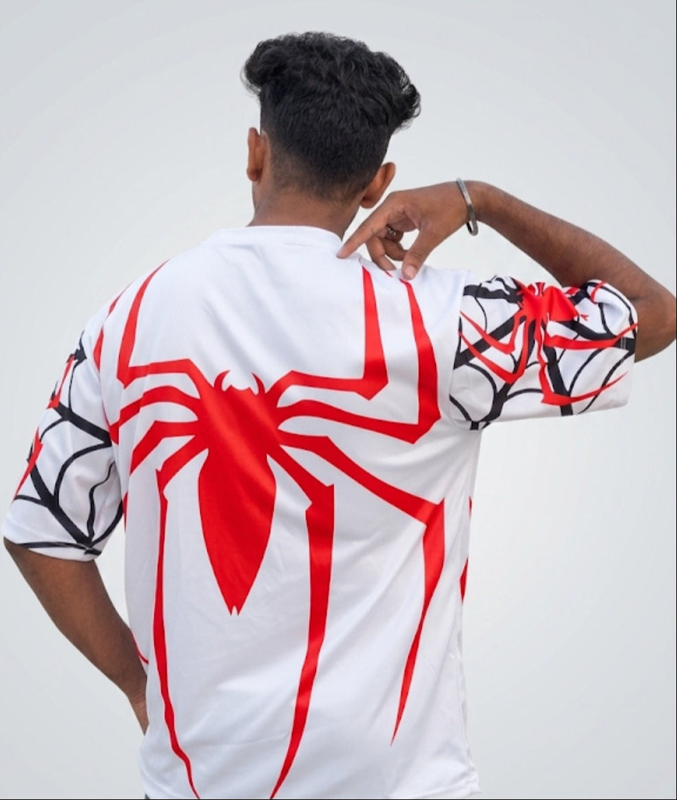 Rear view of a white performance tee showing a large red spider logo design centered on the back